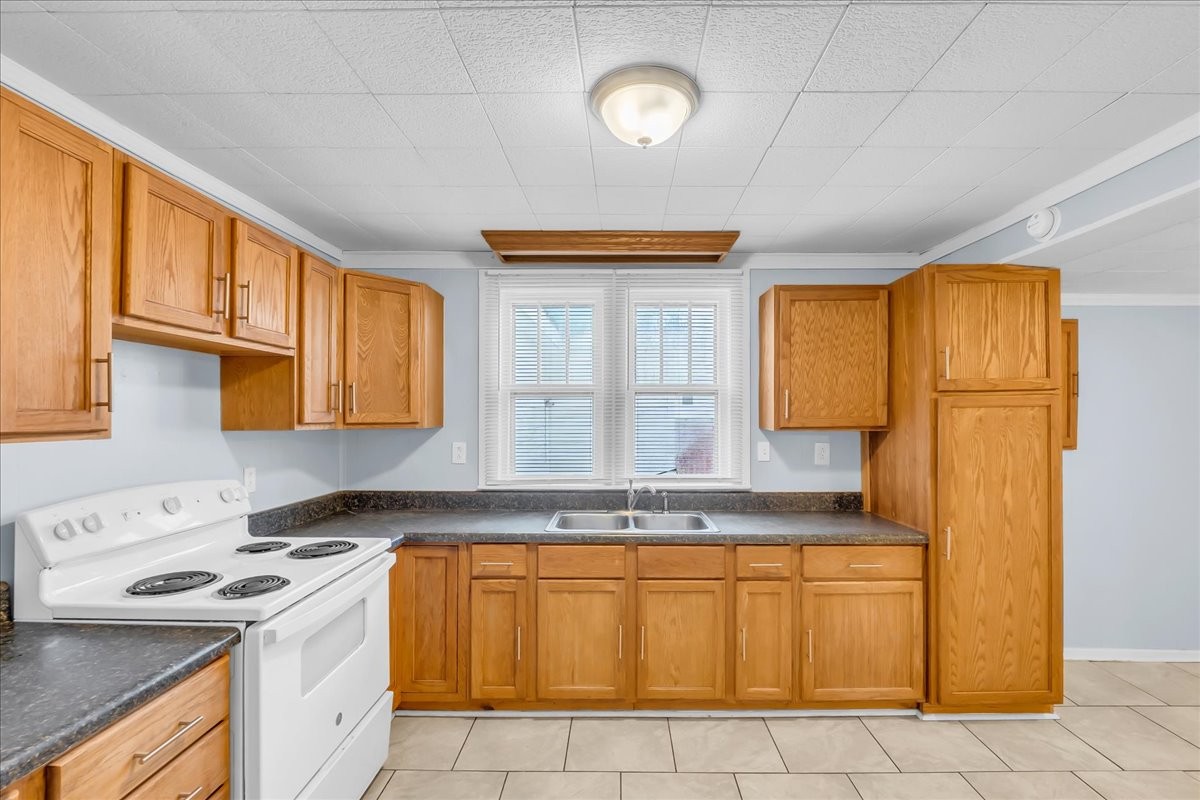 807 Perrigan Lane Manchester, TN 37355 - Photo 26 of 44 a kitchen with granite countertop a sink and a stove
