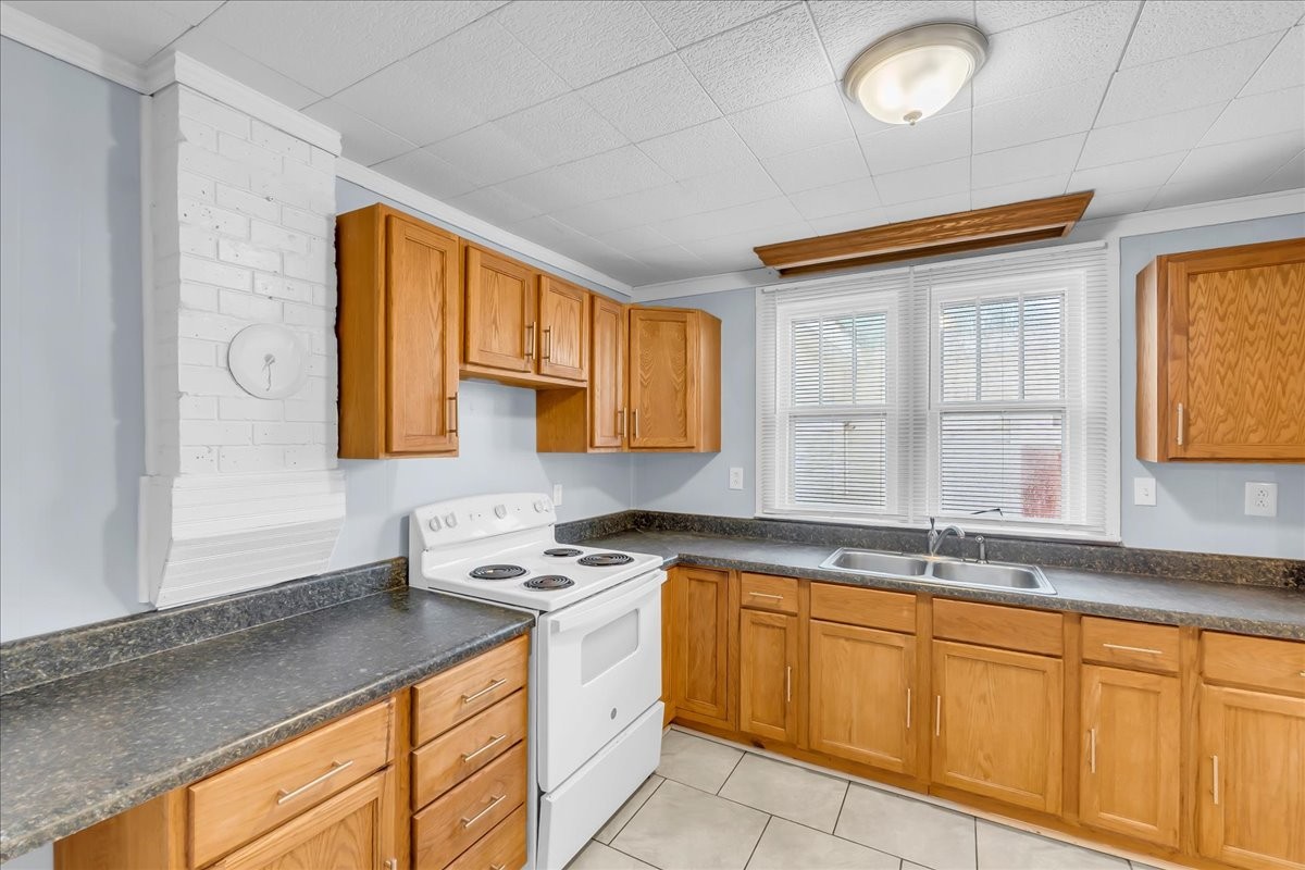 807 Perrigan Lane Manchester, TN 37355 - Photo 27 of 44 a kitchen with granite countertop cabinets sink and a granite counter tops