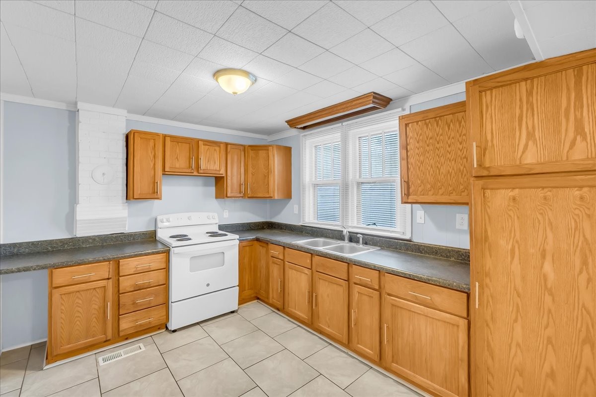 807 Perrigan Lane Manchester, TN 37355 - Photo 28 of 44 a kitchen with stainless steel appliances granite countertop a sink and cabinets