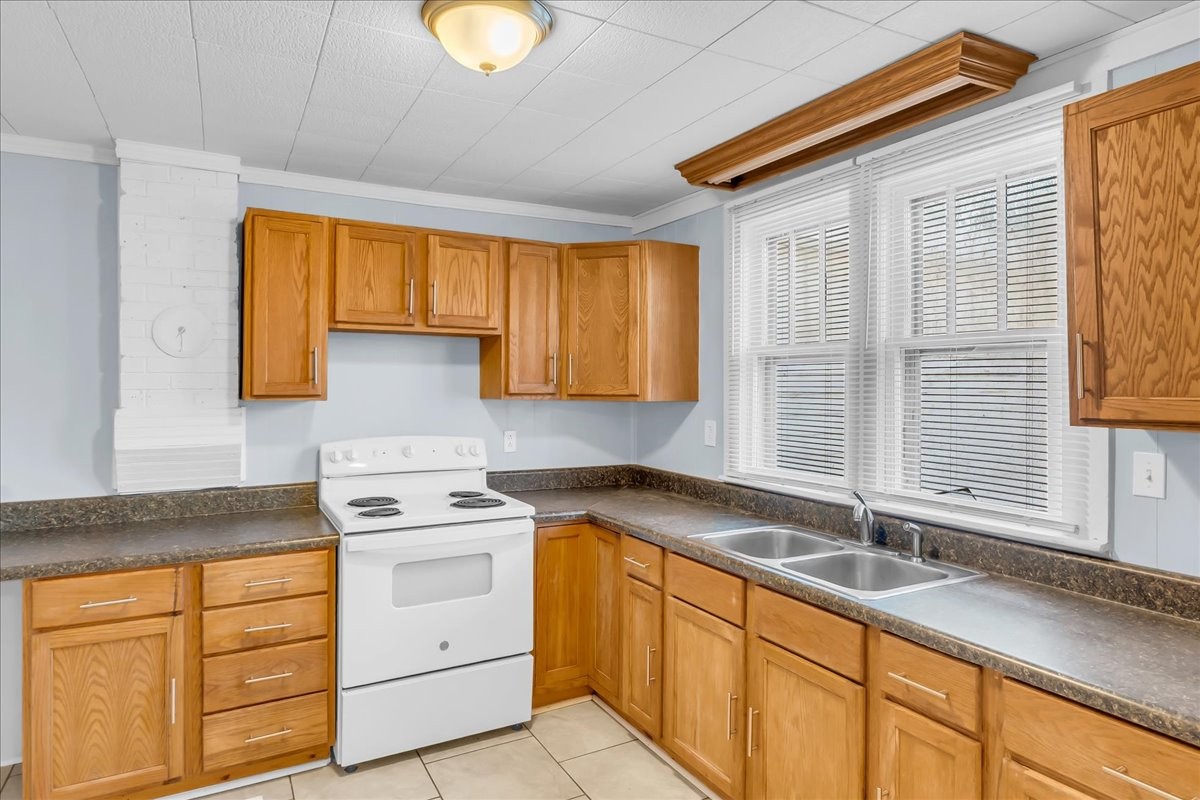807 Perrigan Lane Manchester, TN 37355 - Photo 29 of 44 a kitchen with granite countertop a sink a window cabinets and stainless steel appliances