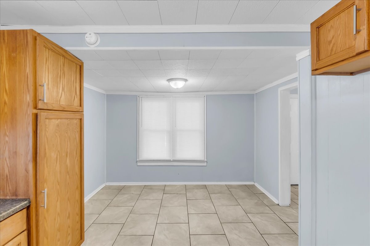 807 Perrigan Lane Manchester, TN 37355 - Photo 30 of 44 a view of an empty room with wooden floor and a window