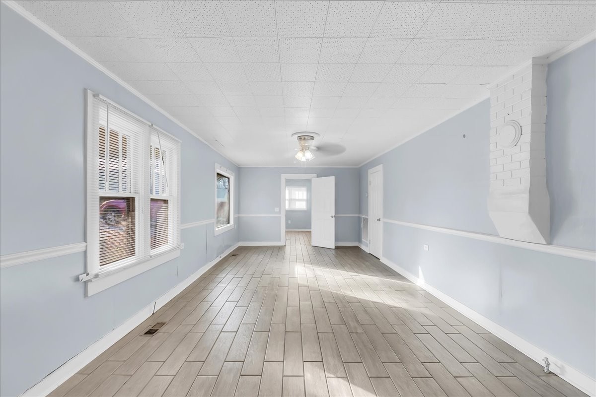 807 Perrigan Lane Manchester, TN 37355 - Photo 9 of 44 a view of a hallway with wooden floor and a window