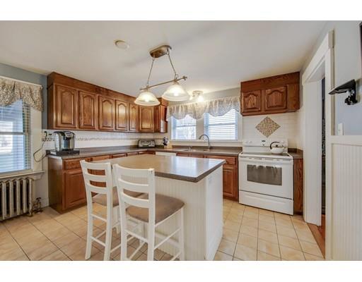 15 Great Road Stow, MA 01775 - Photo 2 of 24 a kitchen with stainless steel appliances kitchen island granite countertop a stove a sink and a refrigerator