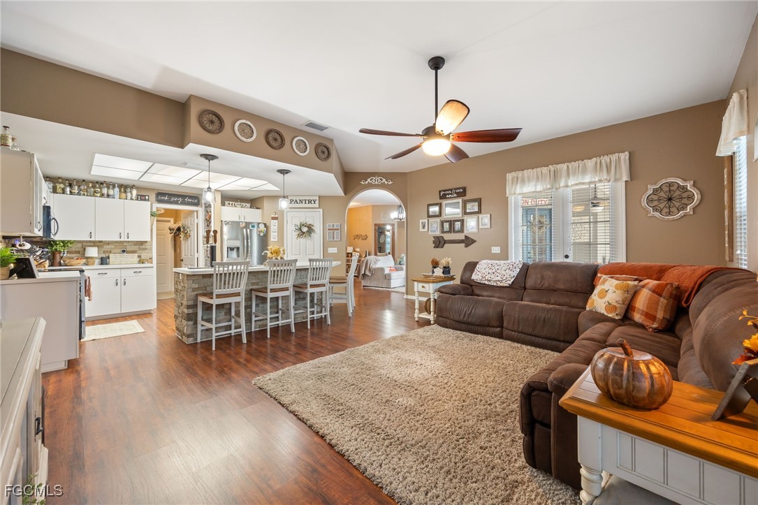 914 Sawgrass Street Clewiston, FL 33440 - Photo 15 of 43 a living room with furniture and wooden floor