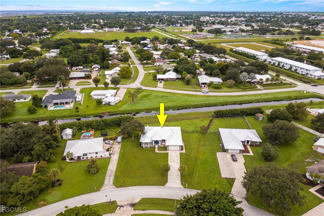 914 Sawgrass Street Clewiston, FL 33440 - Photo 37 of 43 an aerial view of a city with lots of residential buildings ocean and mountain view
