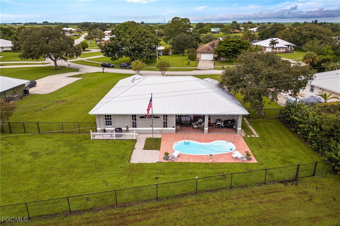 914 Sawgrass Street Clewiston, FL 33440 - Photo 41 of 43 an aerial view of residential houses with outdoor space
