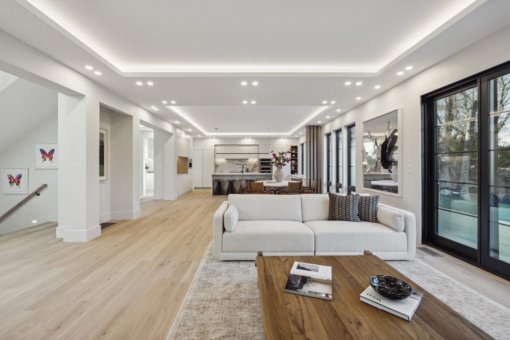 9 Bellevue Road Wellesley, MA 02481 - Photo 15 of 38 a living room with furniture and a large window