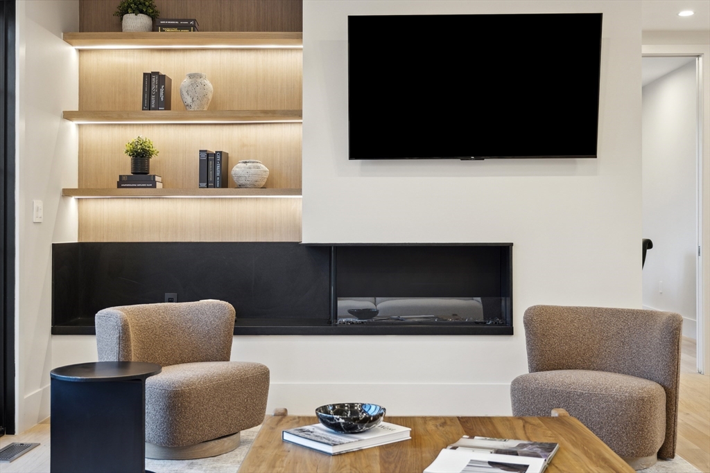 9 Bellevue Road Wellesley, MA 02481 - Photo 16 of 38 a living room with furniture and a flat screen tv