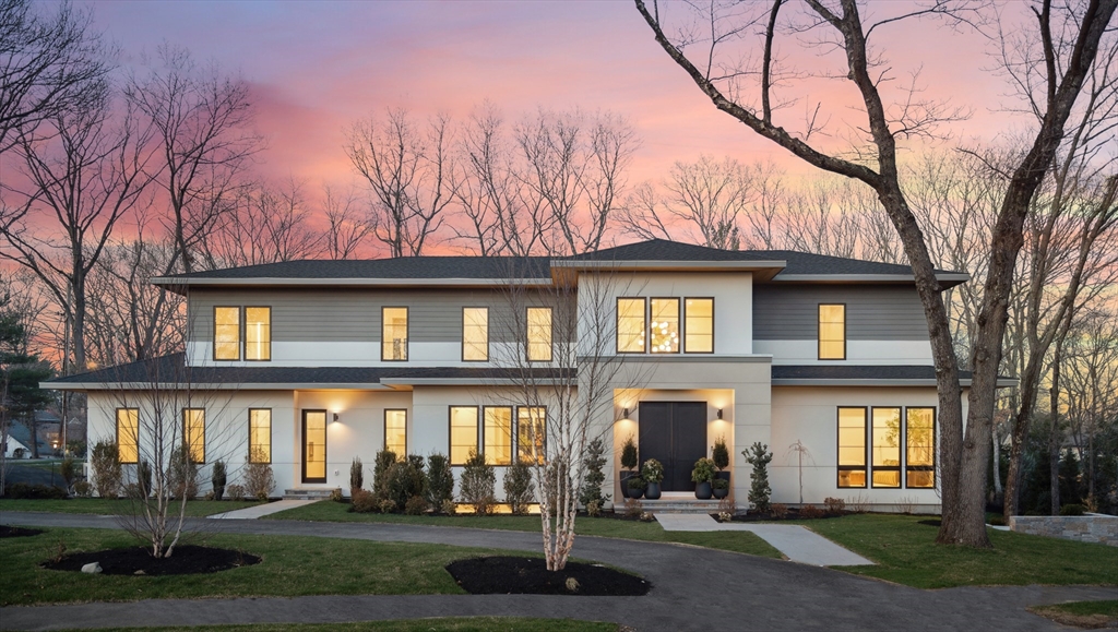 9 Bellevue Road Wellesley, MA 02481 - Photo 2 of 38 a front view of a residential apartment building with a yard
