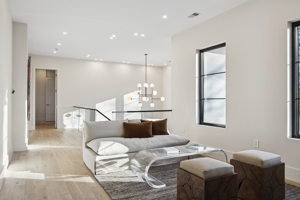 9 Bellevue Road Wellesley, MA 02481 - Photo 23 of 38 a bedroom with furniture and a chandelier