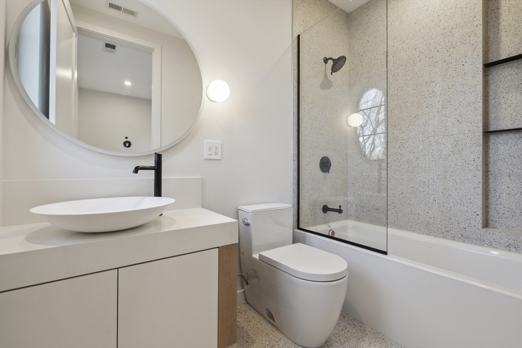 9 Bellevue Road Wellesley, MA 02481 - Photo 29 of 38 a bathroom with a sink a toilet and shower