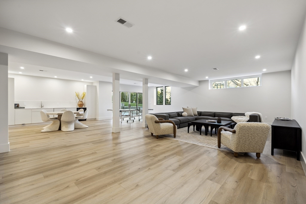 9 Bellevue Road Wellesley, MA 02481 - Photo 31 of 38 a living room with furniture and a table with wooden floor