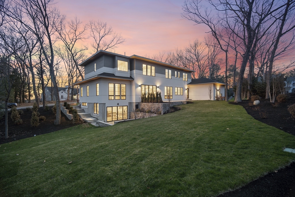 9 Bellevue Road Wellesley, MA 02481 - Photo 36 of 38 a front view of a house with a garden and trees