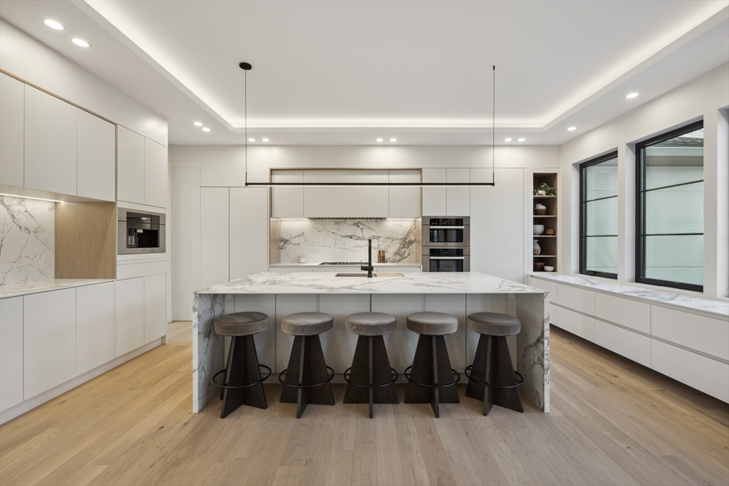 9 Bellevue Road Wellesley, MA 02481 - Photo 7 of 38 a kitchen with a table and chairs in it