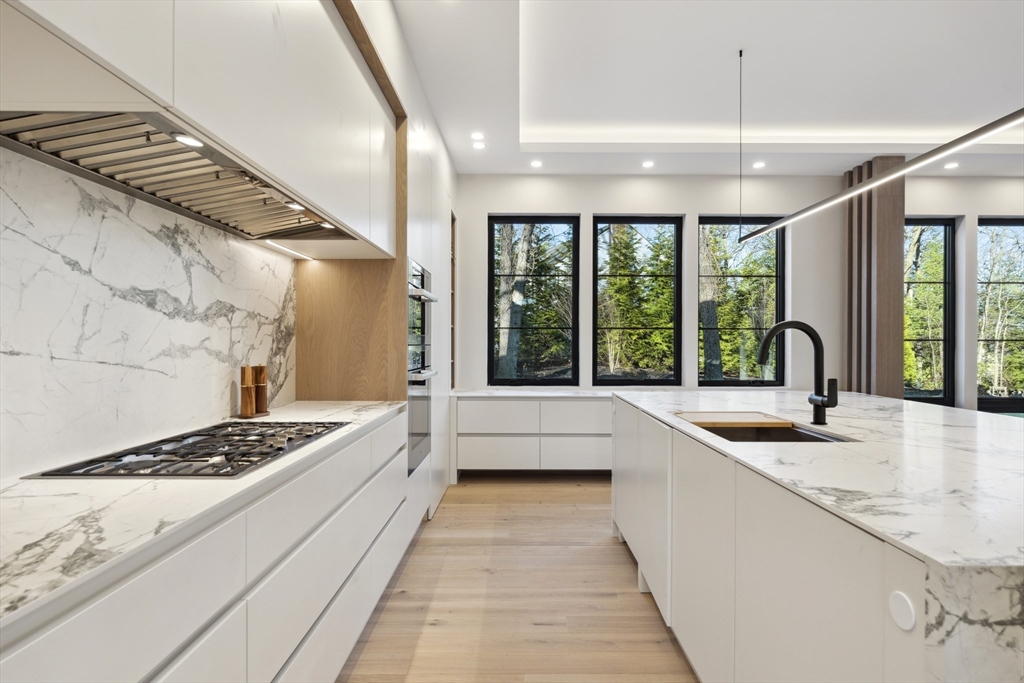 9 Bellevue Road Wellesley, MA 02481 - Photo 8 of 38 a large white kitchen with a large window