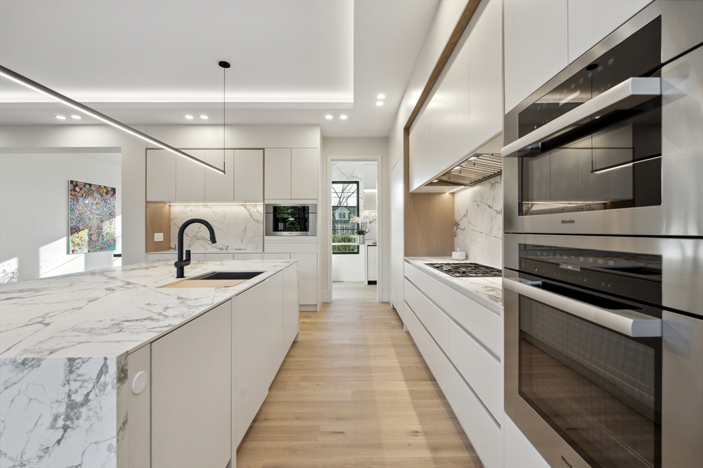 9 Bellevue Road Wellesley, MA 02481 - Photo 9 of 38 a view of a kitchen with a sink and stainless steel appliances