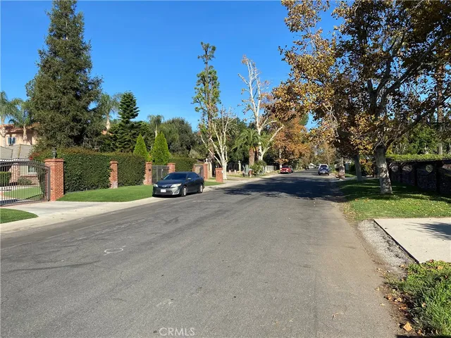 a view of street with parked cars