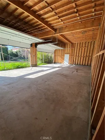 a view of a room with wooden walls