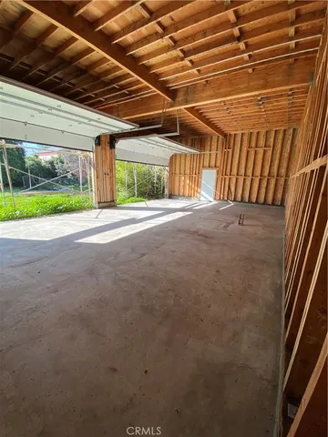 a view of a room with wooden walls
