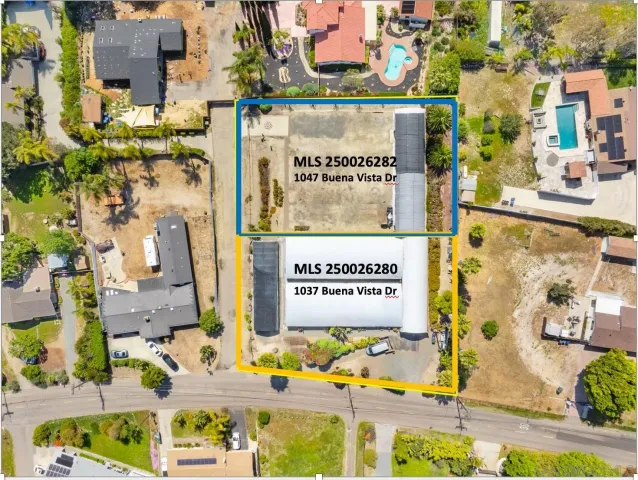 a view of a pathway with a flower garden