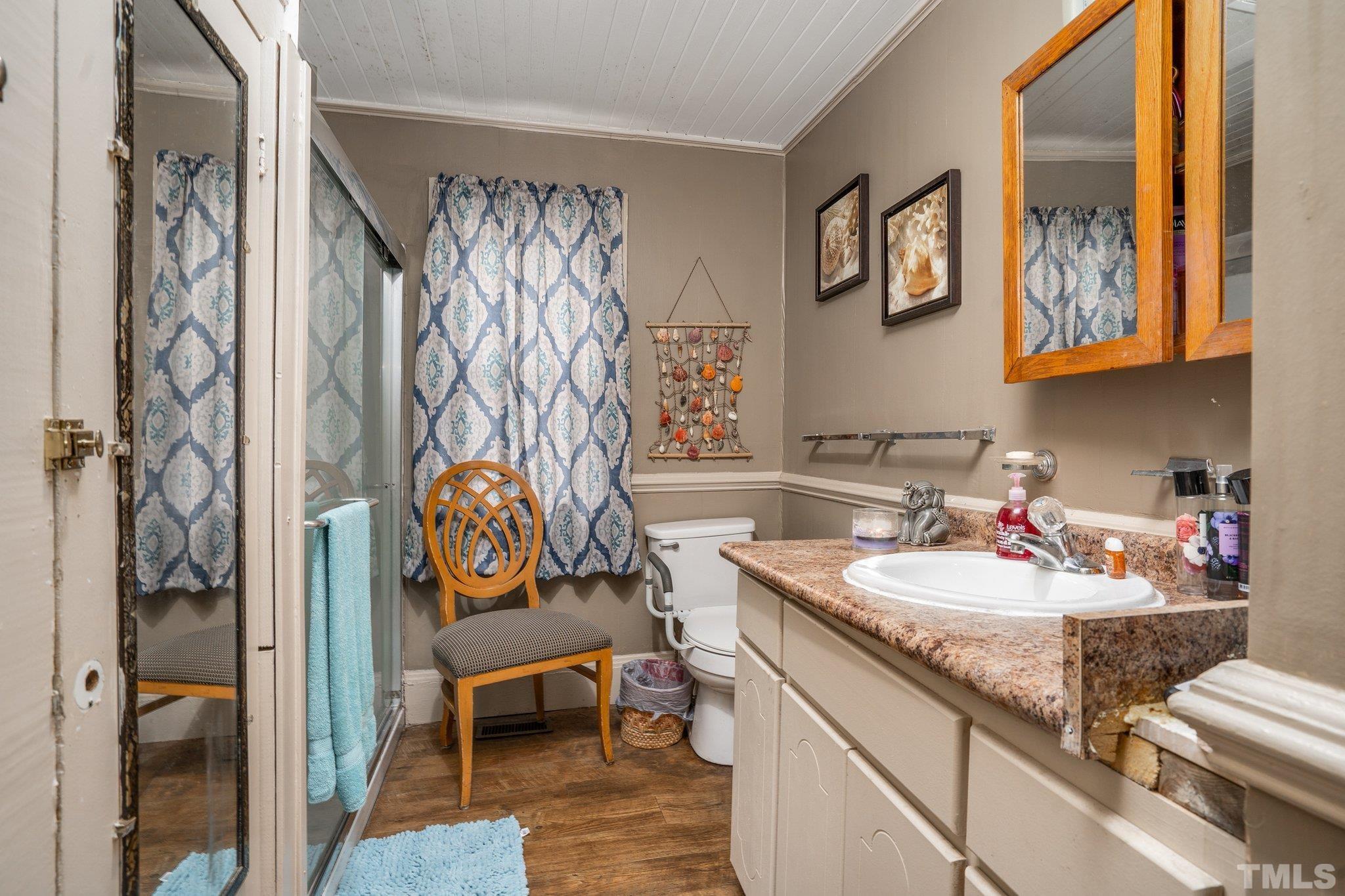 1724 Old Us 64 Spring Spring Hope, NC 27882 - Photo 13 of 23 a bath room with a sink and a mirror
