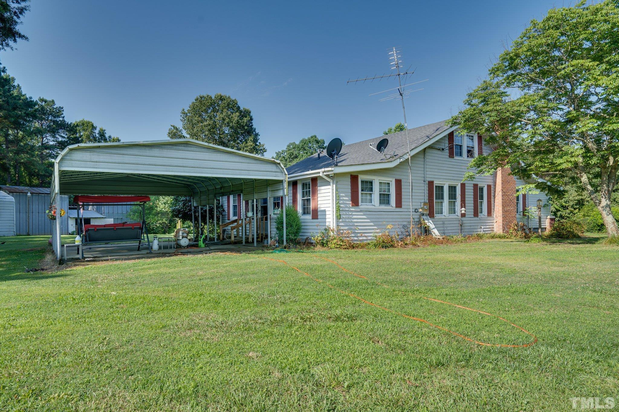 1724 Old Us 64 Spring Spring Hope, NC 27882 - Photo 16 of 23 a front view of a house with a garden