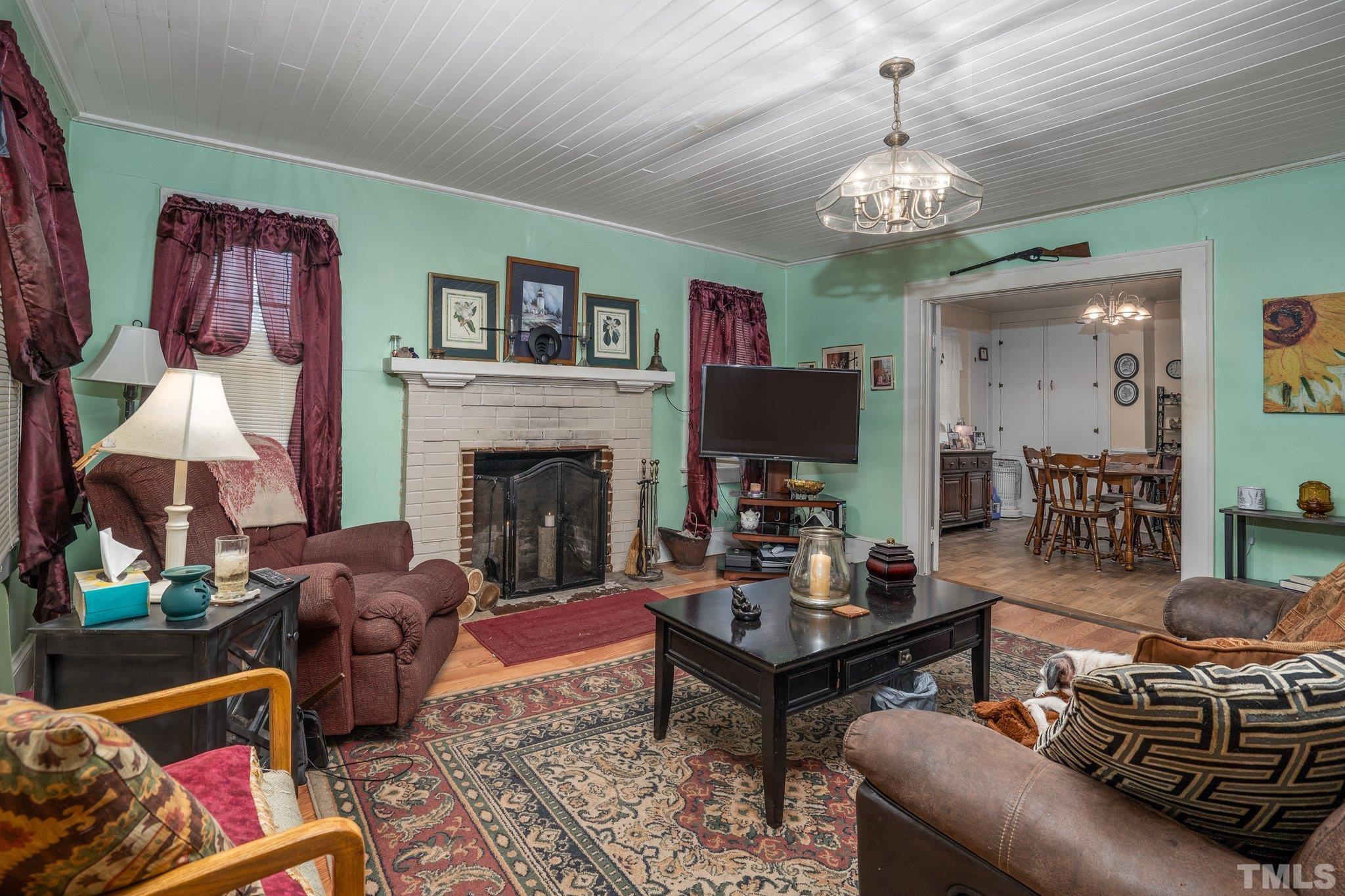 1724 Old Us 64 Spring Spring Hope, NC 27882 - Photo 3 of 23 a living room with furniture and a chandelier