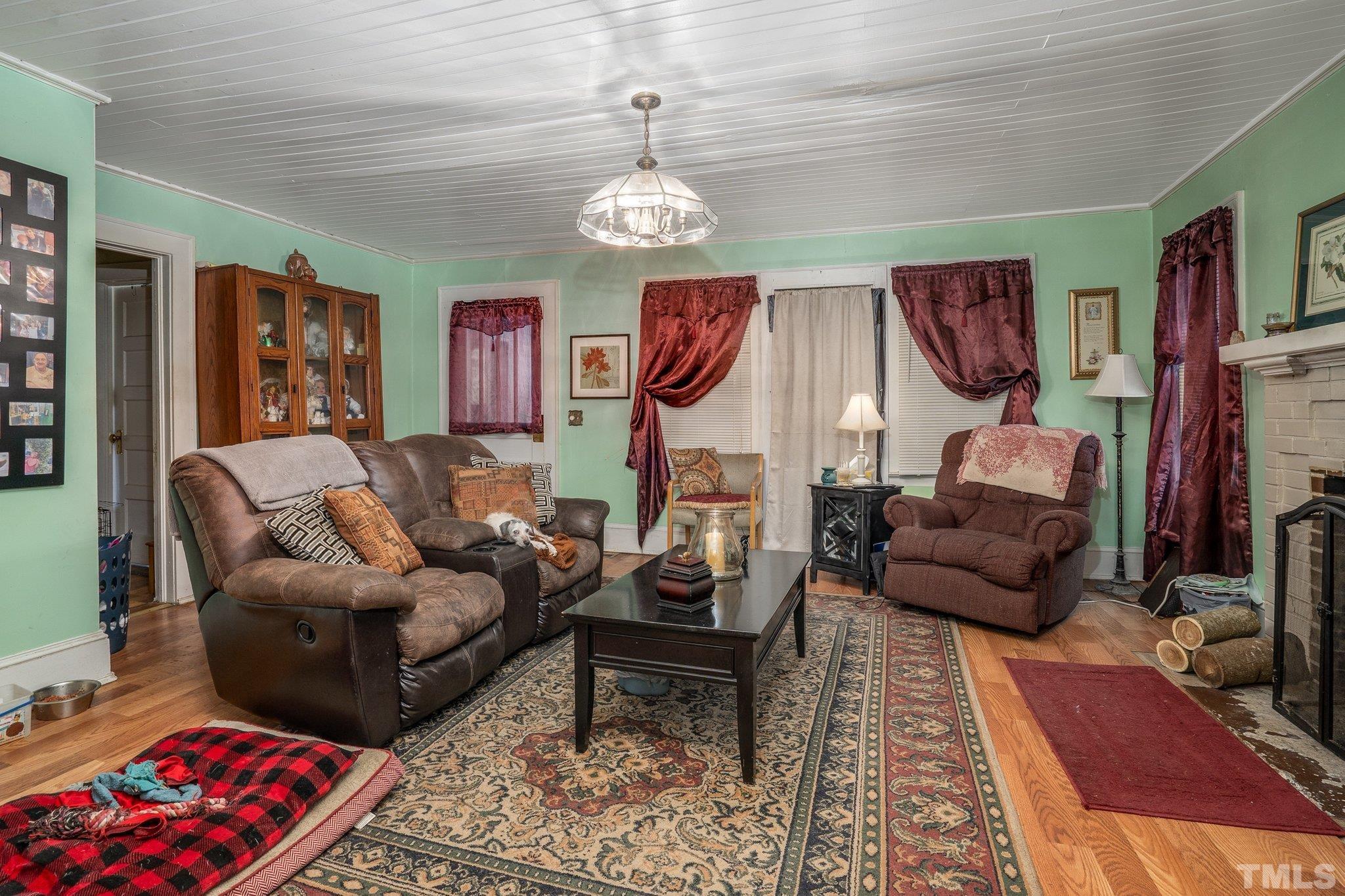 1724 Old Us 64 Spring Spring Hope, NC 27882 - Photo 5 of 23 a living room with furniture and a chandelier