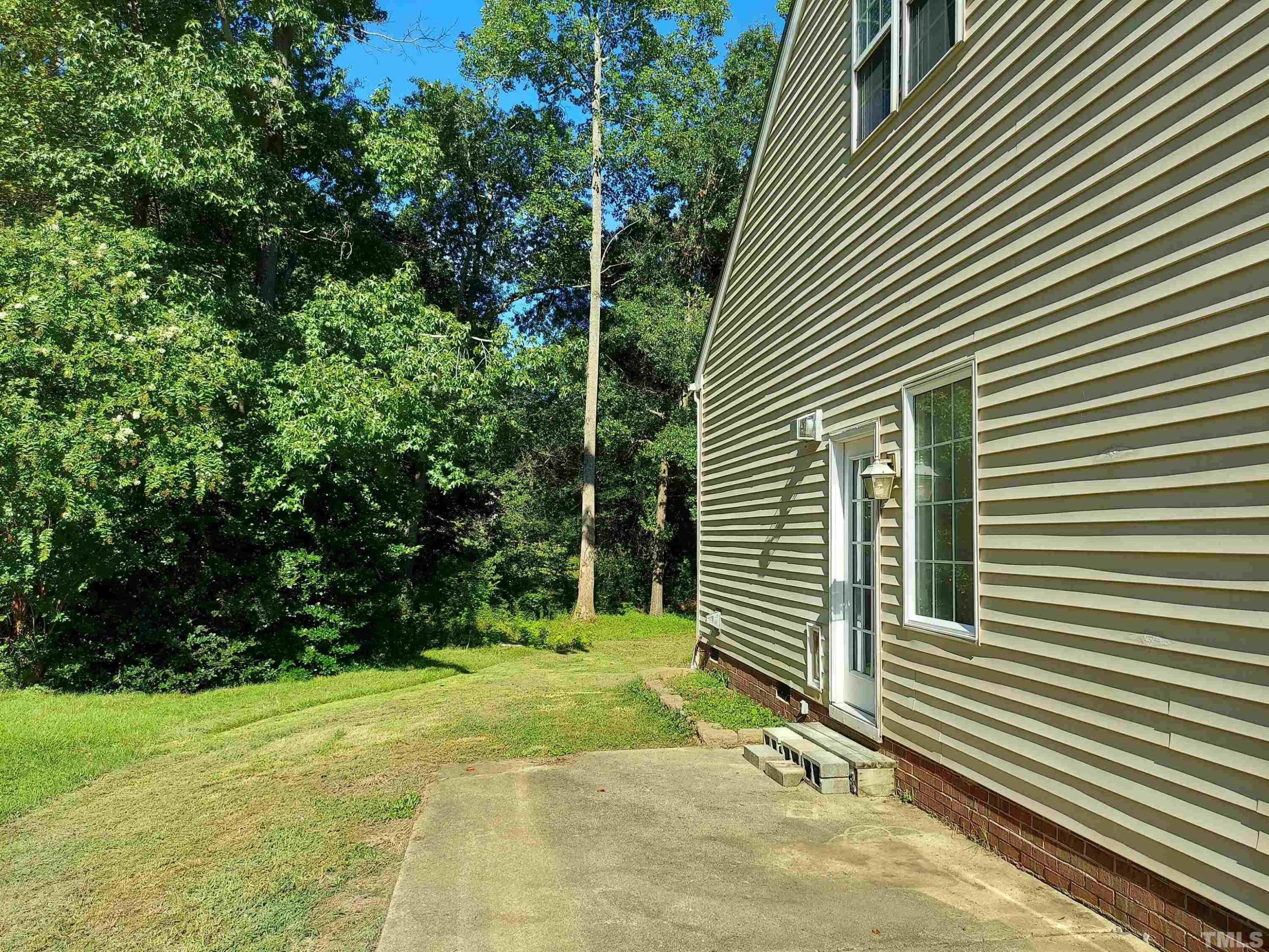 224 Crossfire Road Holly Springs, NC 27540 - Photo 36 of 43 a view of a backyard with plants and entertaining space