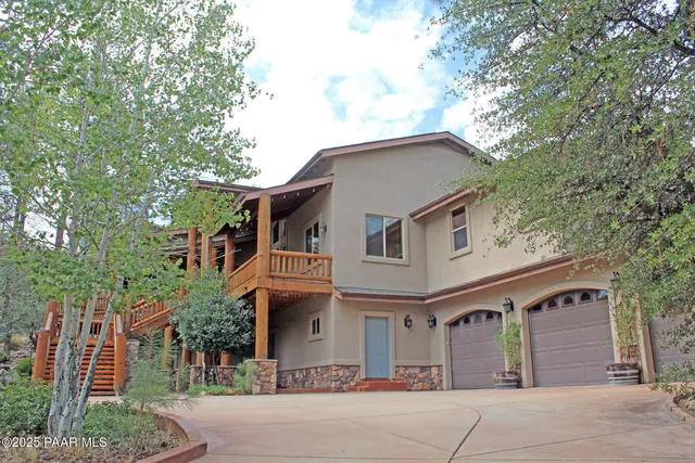 a front view of a house with a garage