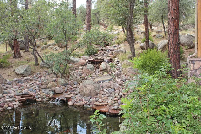 a view of a city with lush green forest