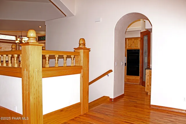 a view of an entryway with wooden floor