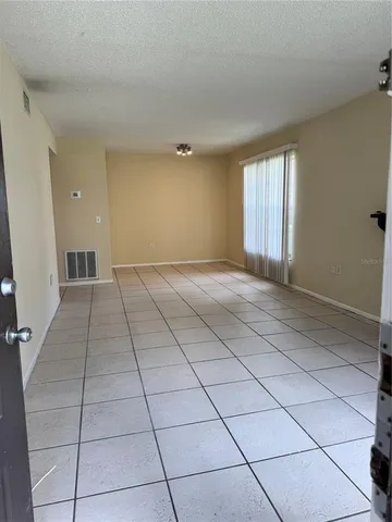 a view of an empty room and window