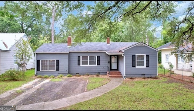 front view of a house with a yard