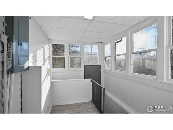 a kitchen with a window and refrigerator