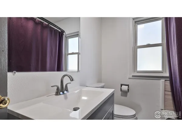 a bathroom with a sink double vanity and a mirror