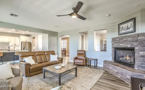 a living room with furniture a window and a fireplace