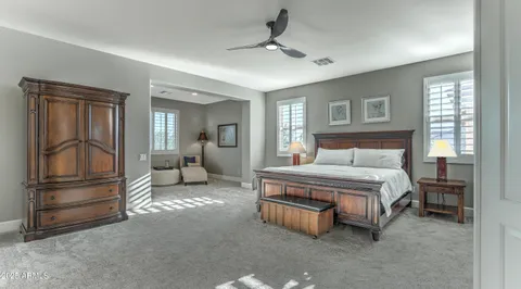 a bathroom with a granite countertop sink mirror and bathtub