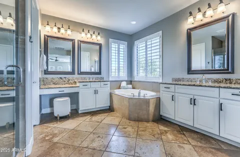 a bathroom with a shower and a sink