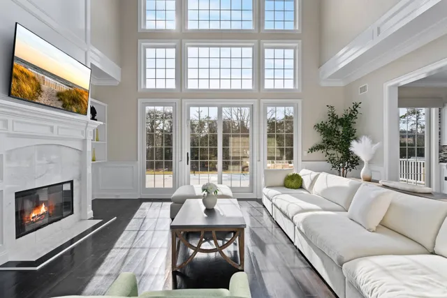 a living room with furniture and a fireplace