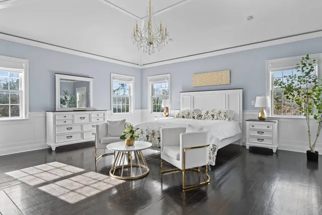 a bed room with furniture and a chandelier