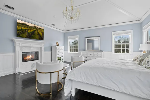 a bedroom with a bed and a fireplace