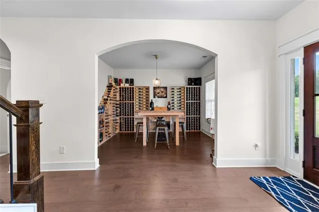 a view of a dining room with furniture and chandelier