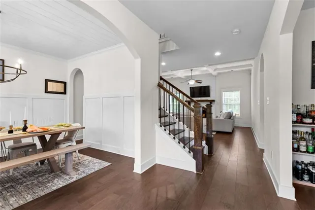 a view of entryway livingroom and hall with wooden floor