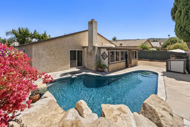 a view of house with yard