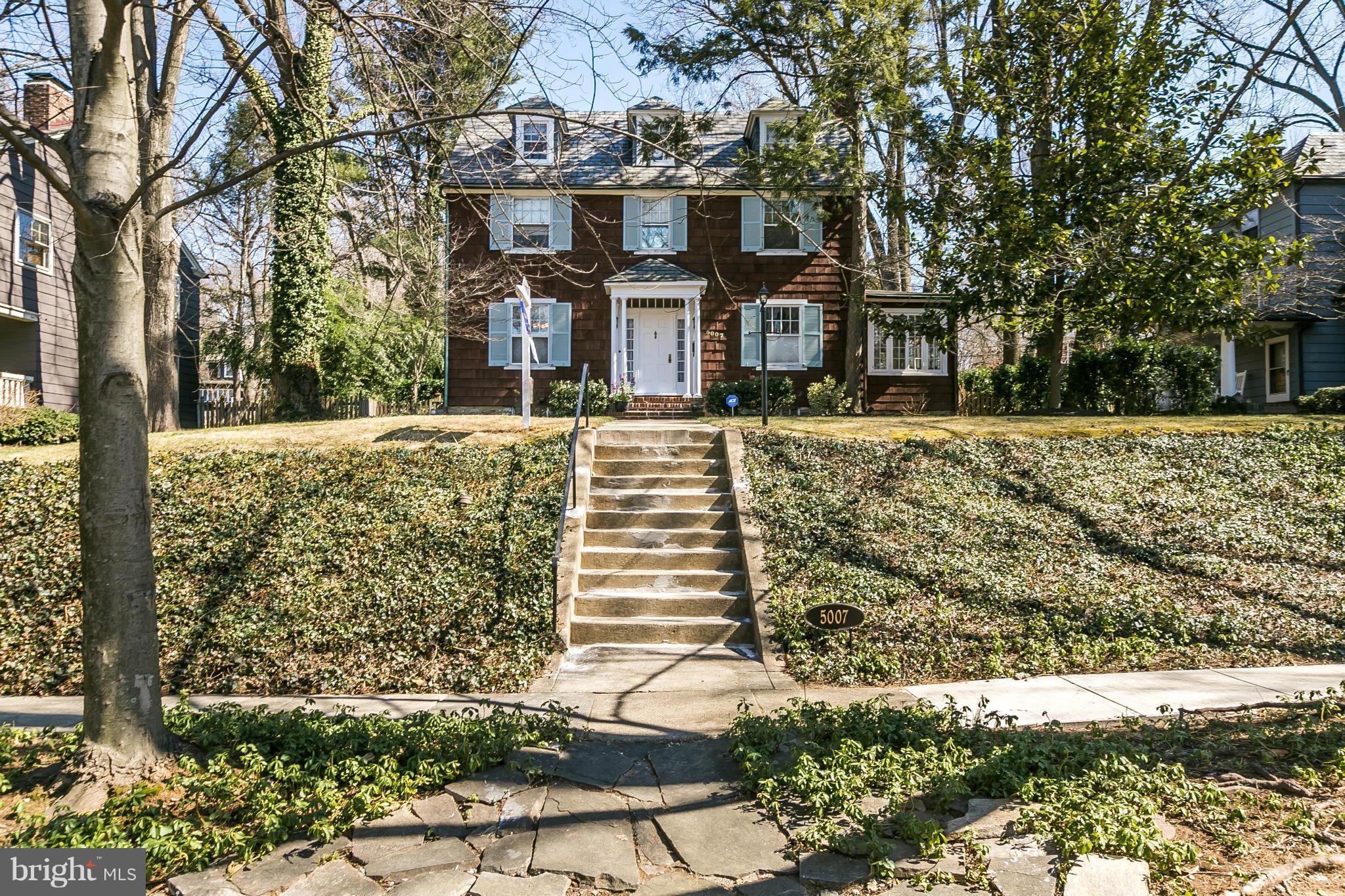 5007 Falls Rd Terrace Baltimore, MD 21210 - Photo 2 of 30 a front view of a house with a yard