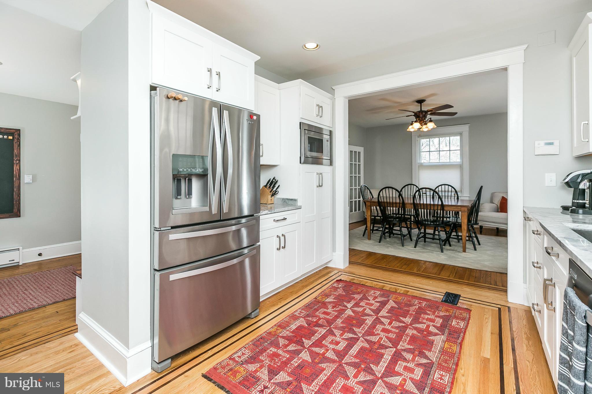 5007 Falls Rd Terrace Baltimore, MD 21210 - Photo 13 of 30 a kitchen with stainless steel appliances granite countertop a refrigerator and microwave