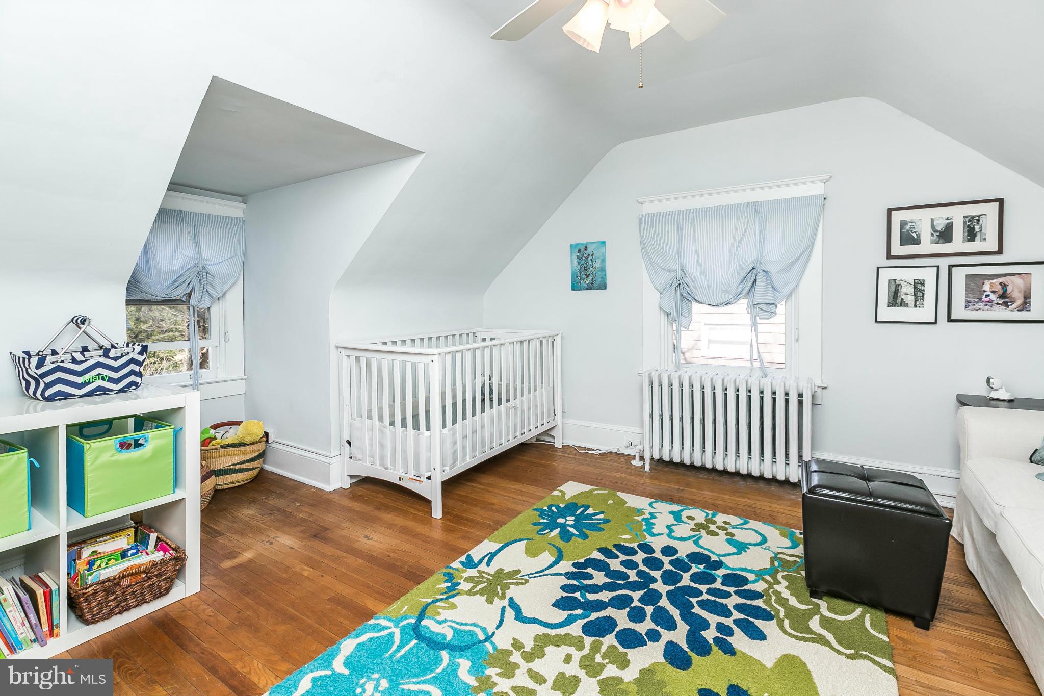 5007 Falls Rd Terrace Baltimore, MD 21210 - Photo 21 of 30 a bedroom with furniture and a window