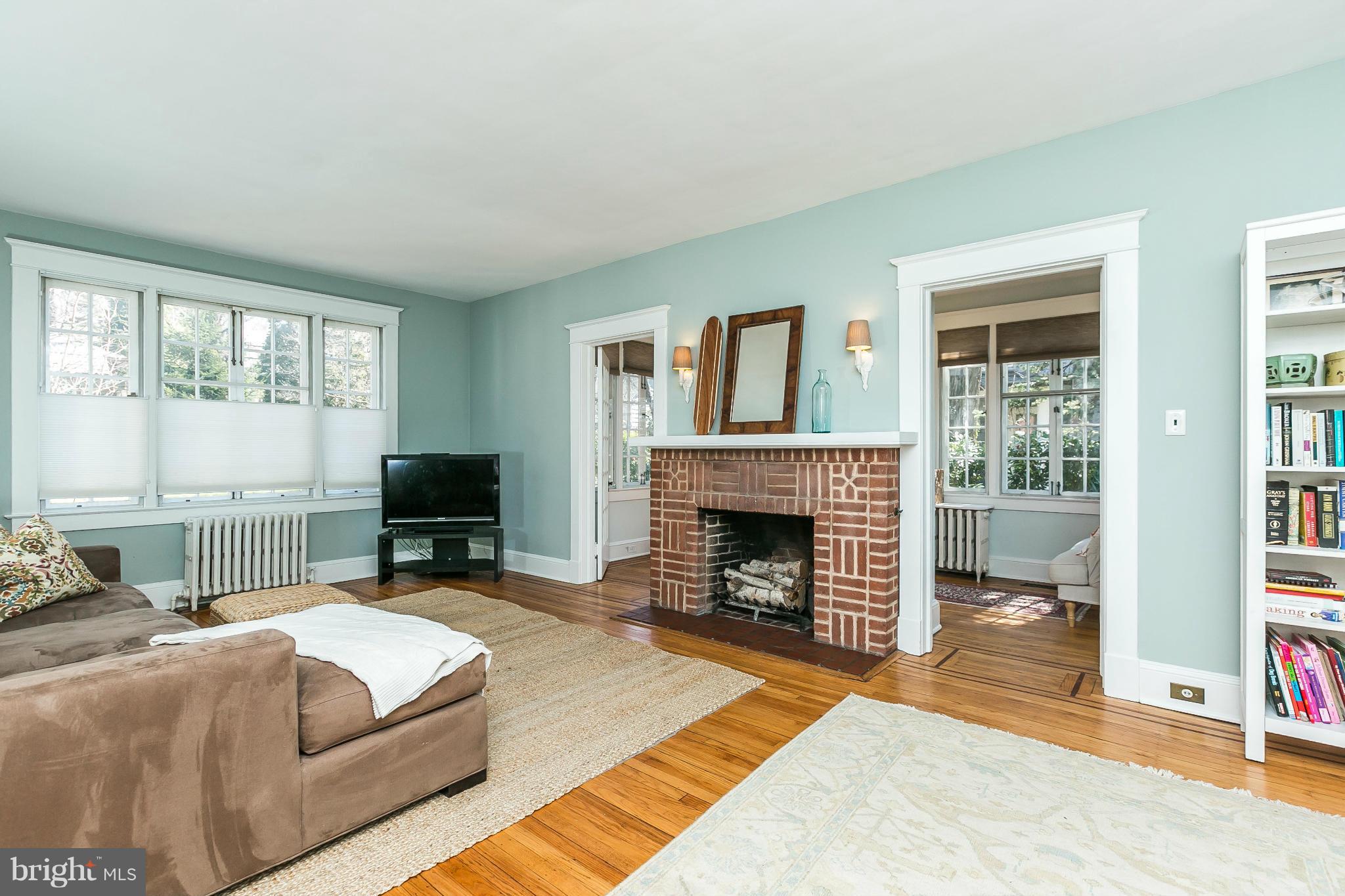 5007 Falls Rd Terrace Baltimore, MD 21210 - Photo 6 of 30 a bedroom with a bed and a fireplace with outer view