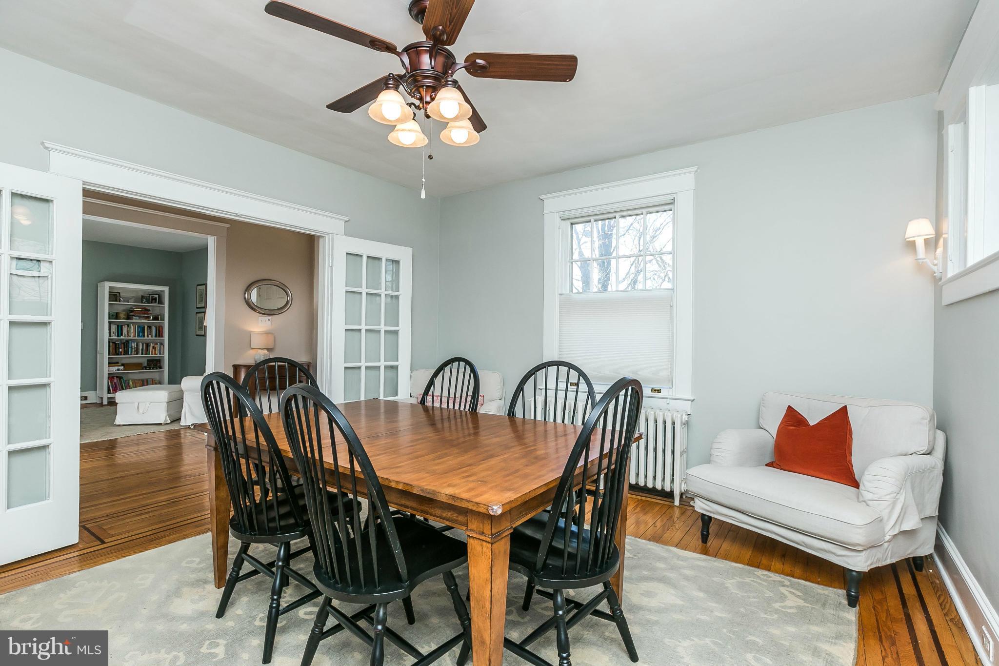 5007 Falls Rd Terrace Baltimore, MD 21210 - Photo 9 of 30 a dining room with furniture a chandelier and wooden floor